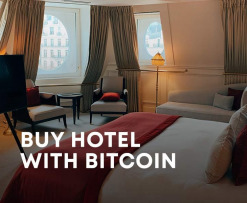 buy hotel with bitcoin